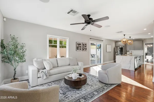 a living room with furniture and a large window