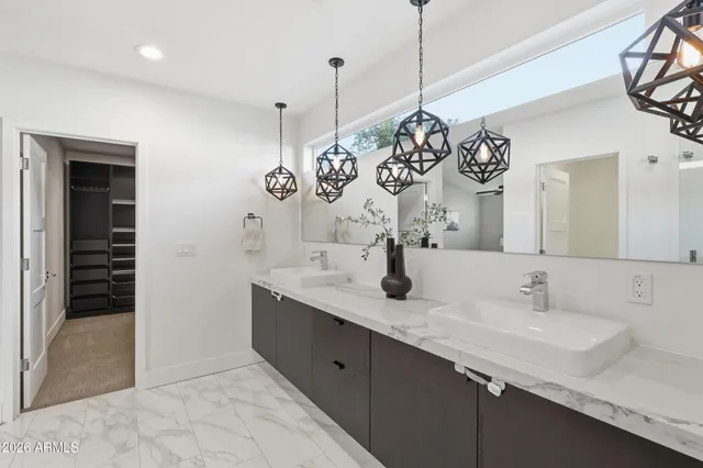 a living room with a bed furniture and a wooden floor