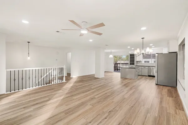 a view of kitchen with cabinets and wooden floor