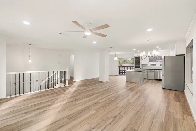 a view of kitchen with cabinets and wooden floor