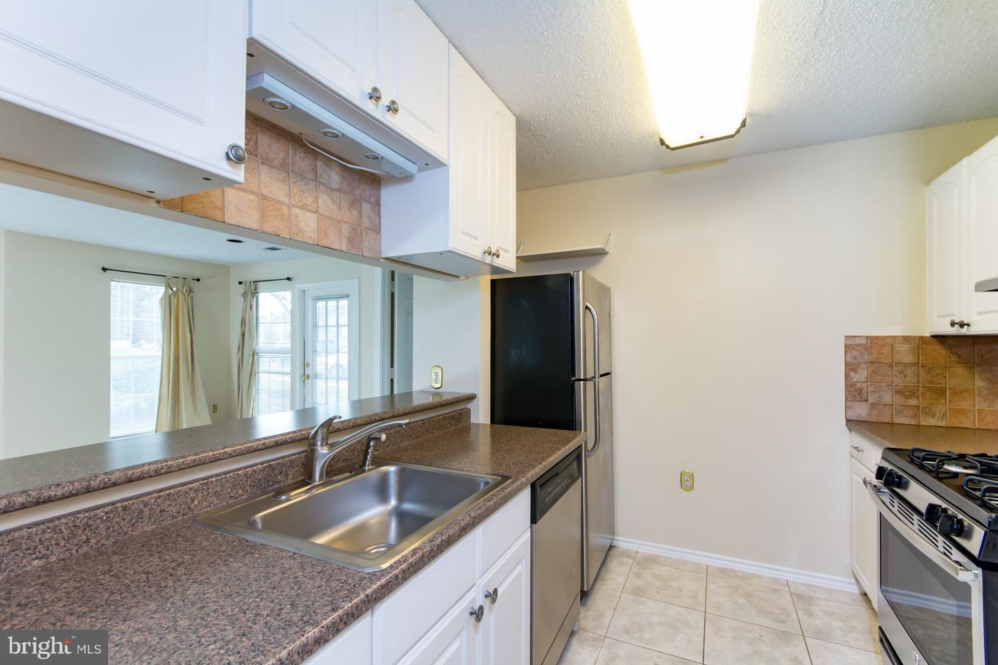 20960 Timber Ridge Terrace, Unit 102 Ashburn, VA 20147 - Photo 5 of 19 Updated Cabinets, Stainless Steel Appliances