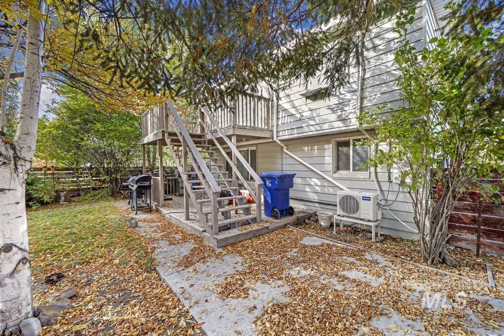 111 2nd Street Rupert, ID 83350 - Photo 6 of 45 Rear exterior featuring a two-story wood deck and stair system