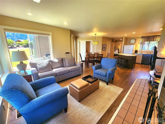 a living room with furniture fireplace and a table