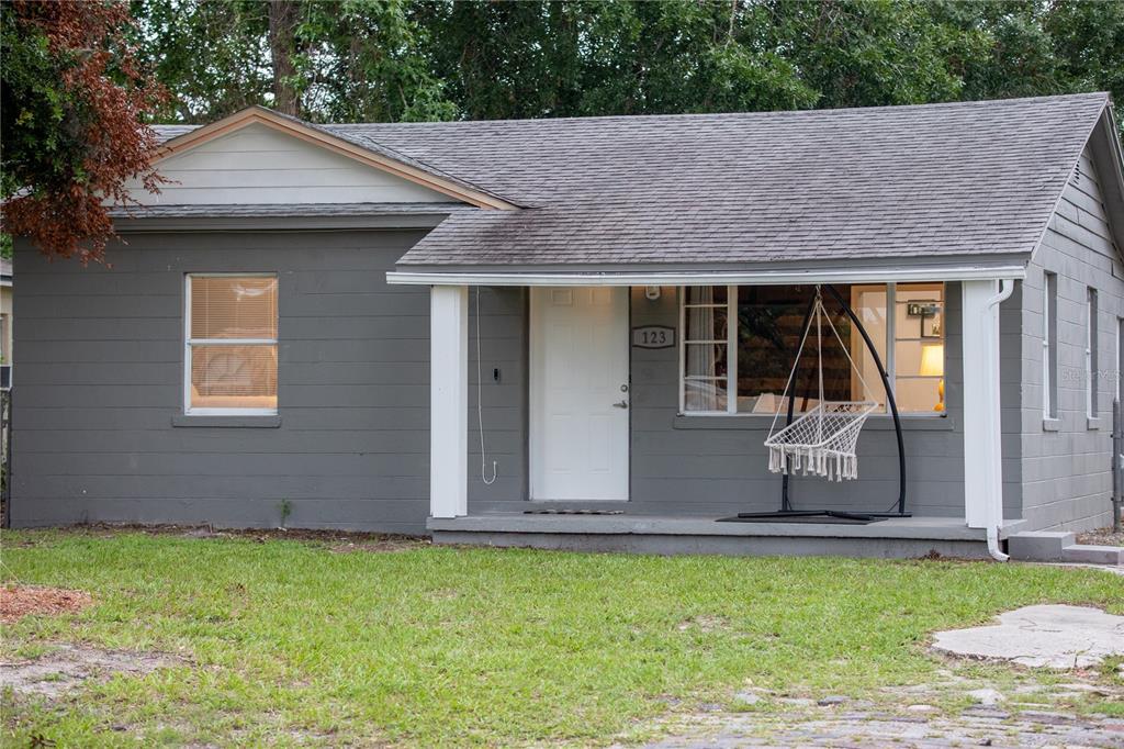 123 Oconee Street Lakeland, FL 33805 - Photo 2 of 25 a front view of a house with garden