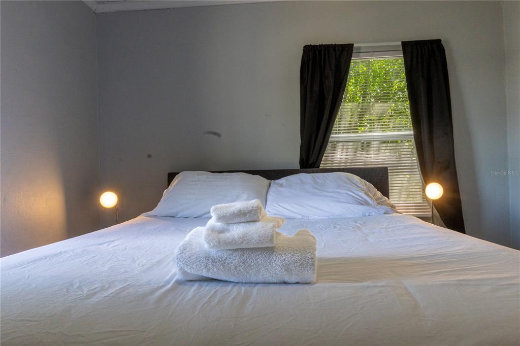 123 Oconee Street Lakeland, FL 33805 - Photo 21 of 25 a large bed sitting in a bedroom next to a window