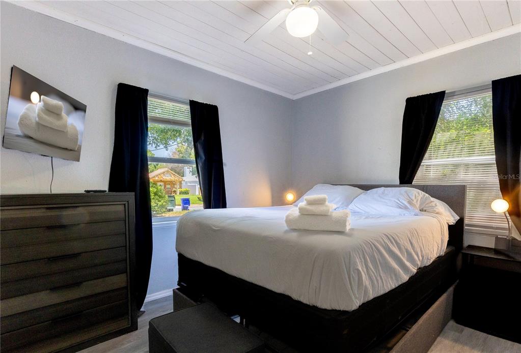 123 Oconee Street Lakeland, FL 33805 - Photo 24 of 25 a bedroom with a bed and a flat screen tv