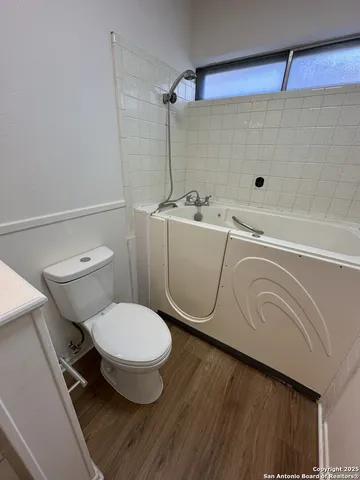 a bathroom with a toilet and a sink