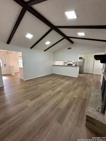 a big room with wooden floor