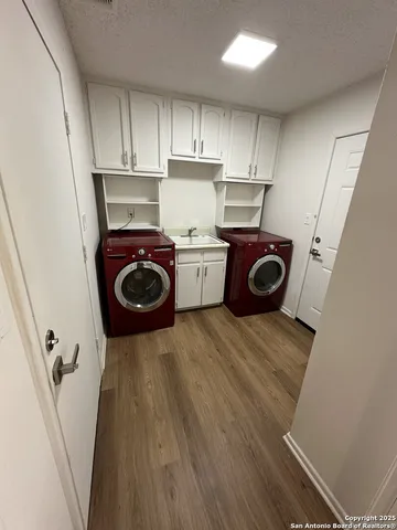 a kitchen with a refrigerator and a stove