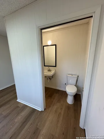 a bathroom with a toilet and a sink