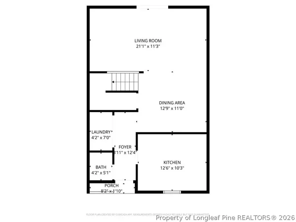 a view of a backyard with wooden fence