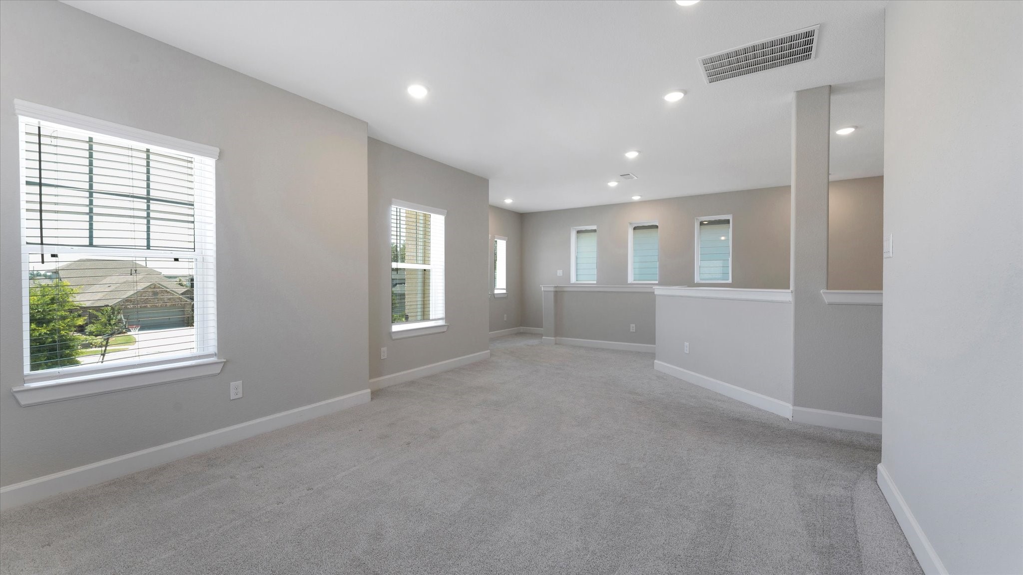 15607 Rising Wren Court Conroe, TX 77302 - Photo 27 of 40 an empty room with windows and closet