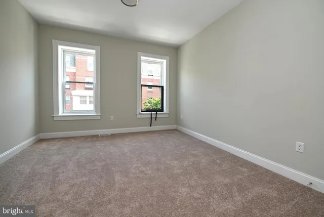 an empty room with windows