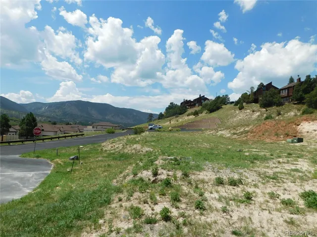 a view of a lake with houses in the back