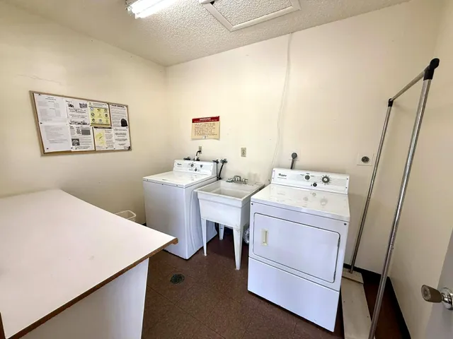 a view of a swimming pool with a patio