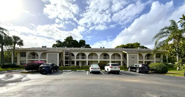 a view of a car park in front of house