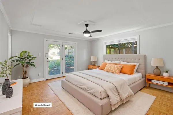 a bedroom with a large bed and a window