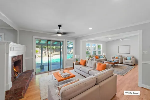 a living room with furniture and a fireplace