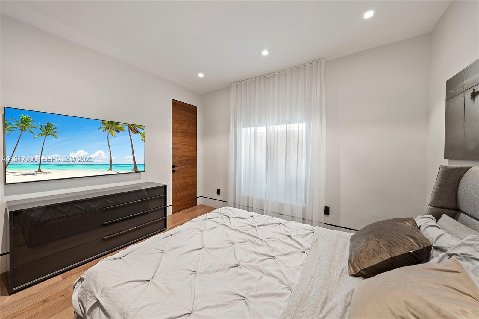900 Washington Street Hollywood, FL 33019 - Photo 23 of 61 a bedroom with a bed and a large window