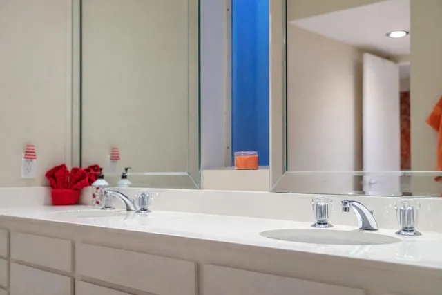 a bathroom with a sink and a mirror