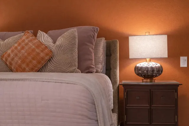 a bedroom with a bed and dresser