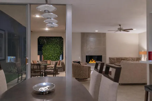 a view of a livingroom with furniture and a chandelier