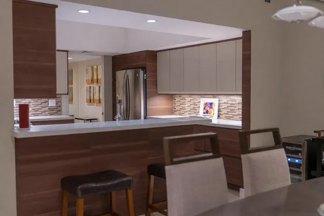 a kitchen with a sink cabinets and window