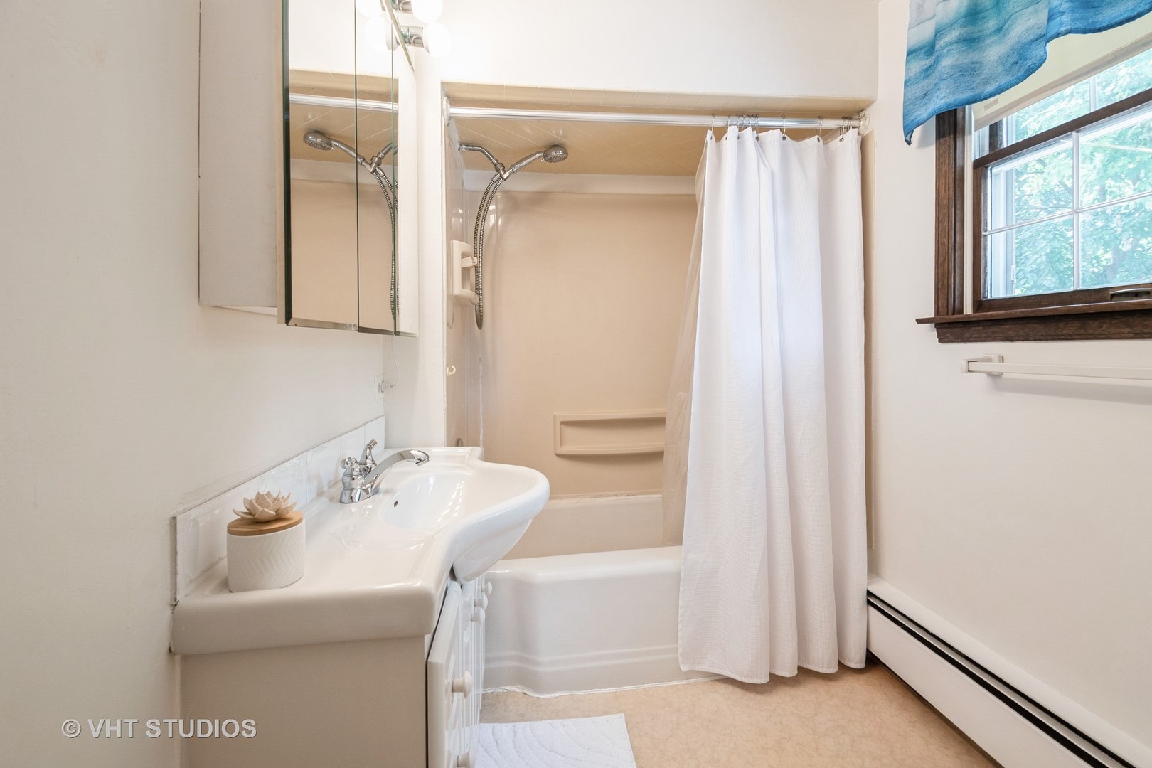 1345 Hickory Road Homewood, IL 60430 - Photo 18 of 28 a bathroom with a sink a mirror and a shower