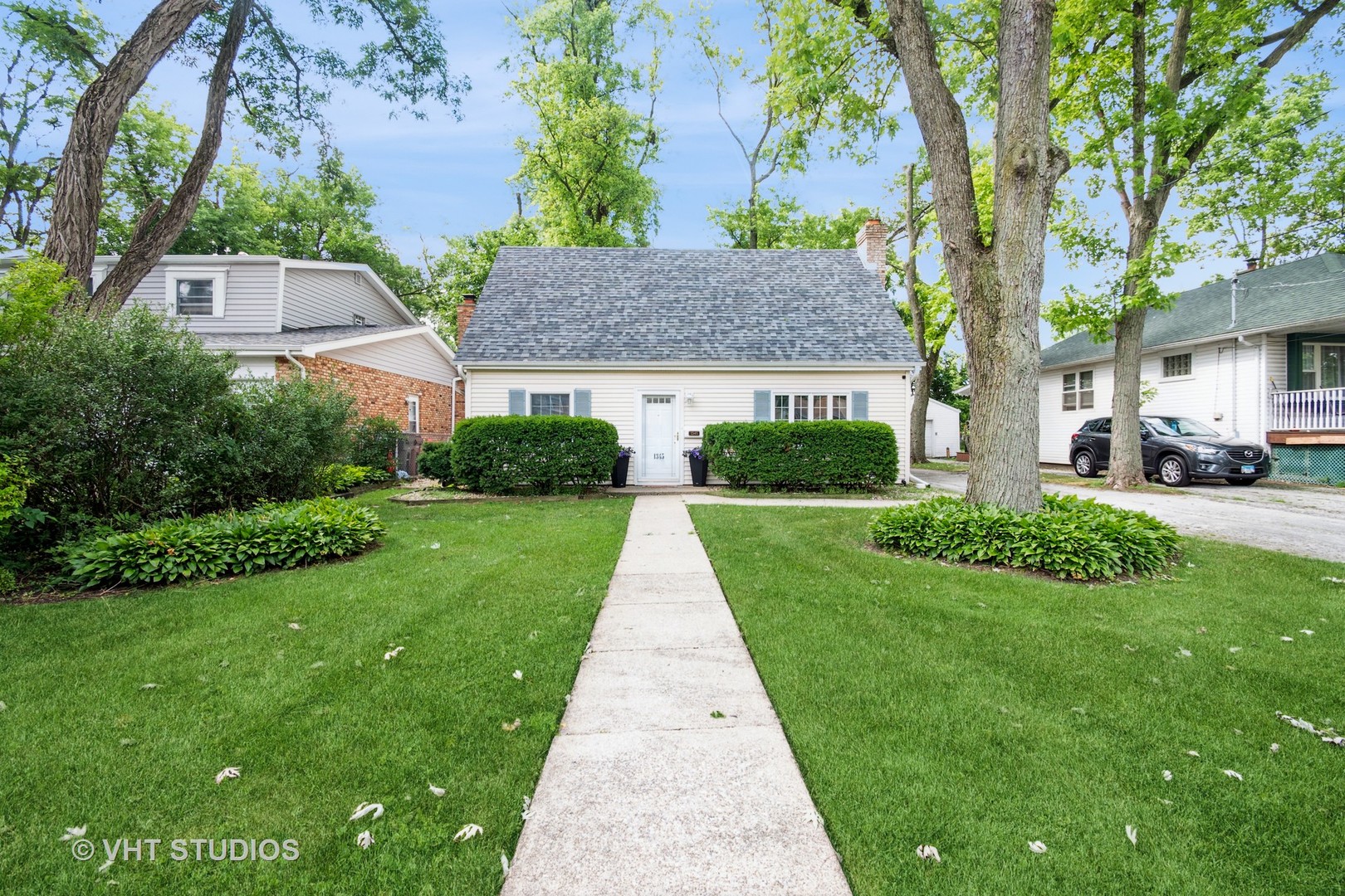 1345 Hickory Road Homewood, IL 60430 - Photo 2 of 28 a front view of a house with a yard