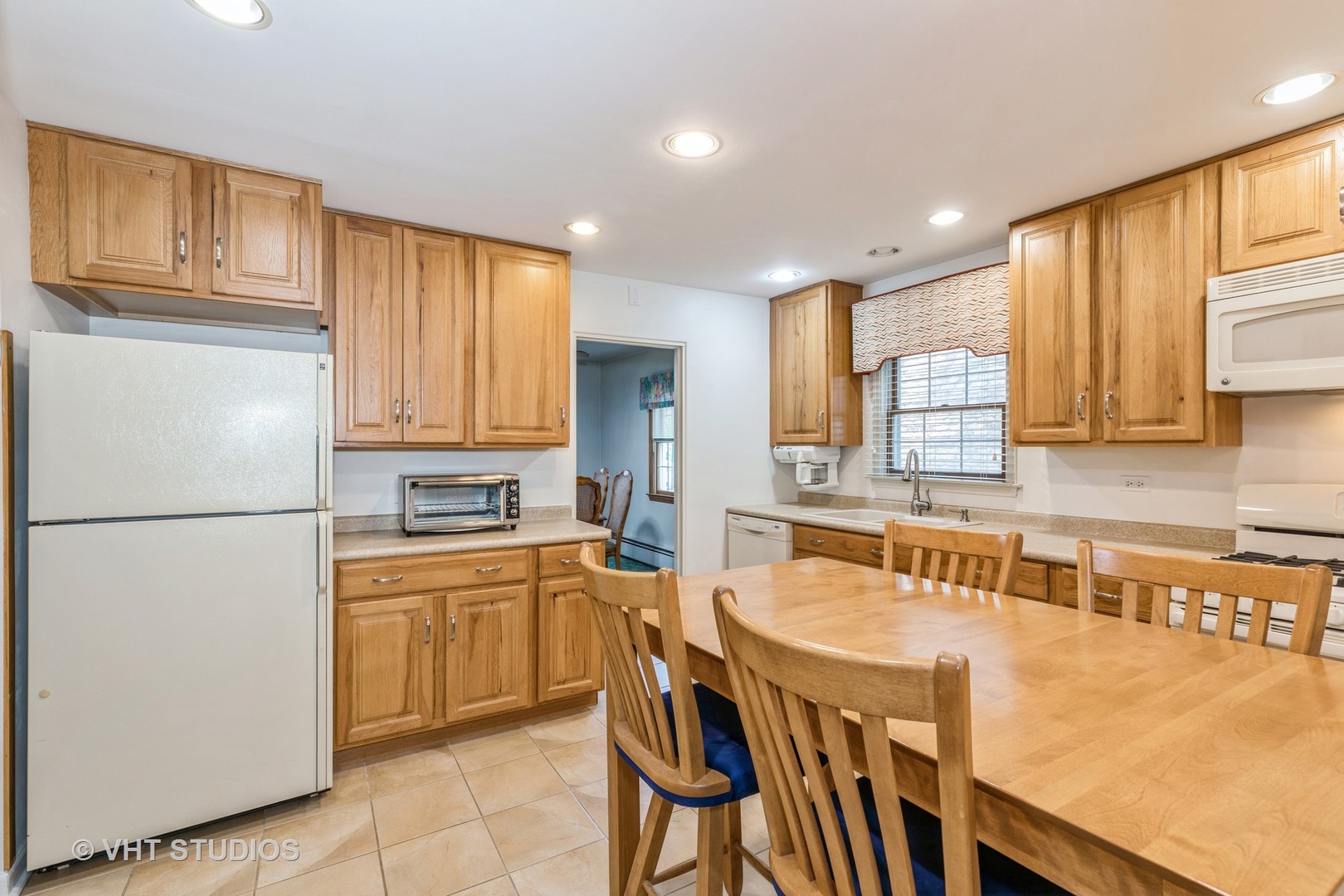 1345 Hickory Road Homewood, IL 60430 - Photo 7 of 28 a kitchen with stainless steel appliances granite countertop a refrigerator a sink a stove and white cabinets