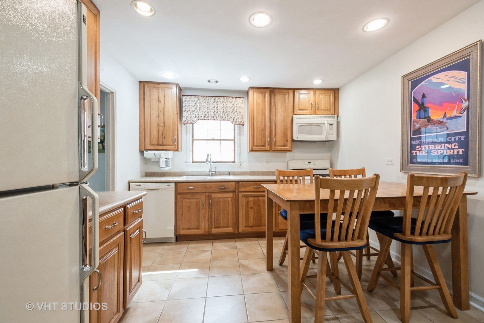 1345 Hickory Road Homewood, IL 60430 - Photo 8 of 28 a kitchen with stainless steel appliances granite countertop a stove top oven a sink a dining table and chairs