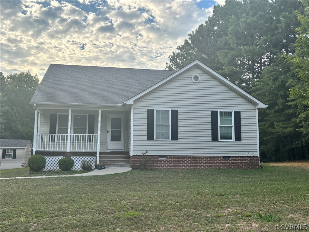 679 Deep Landing Road Tappahannock, VA 22560 - Photo 1 of 1 View of front of home with a porch and a front yar