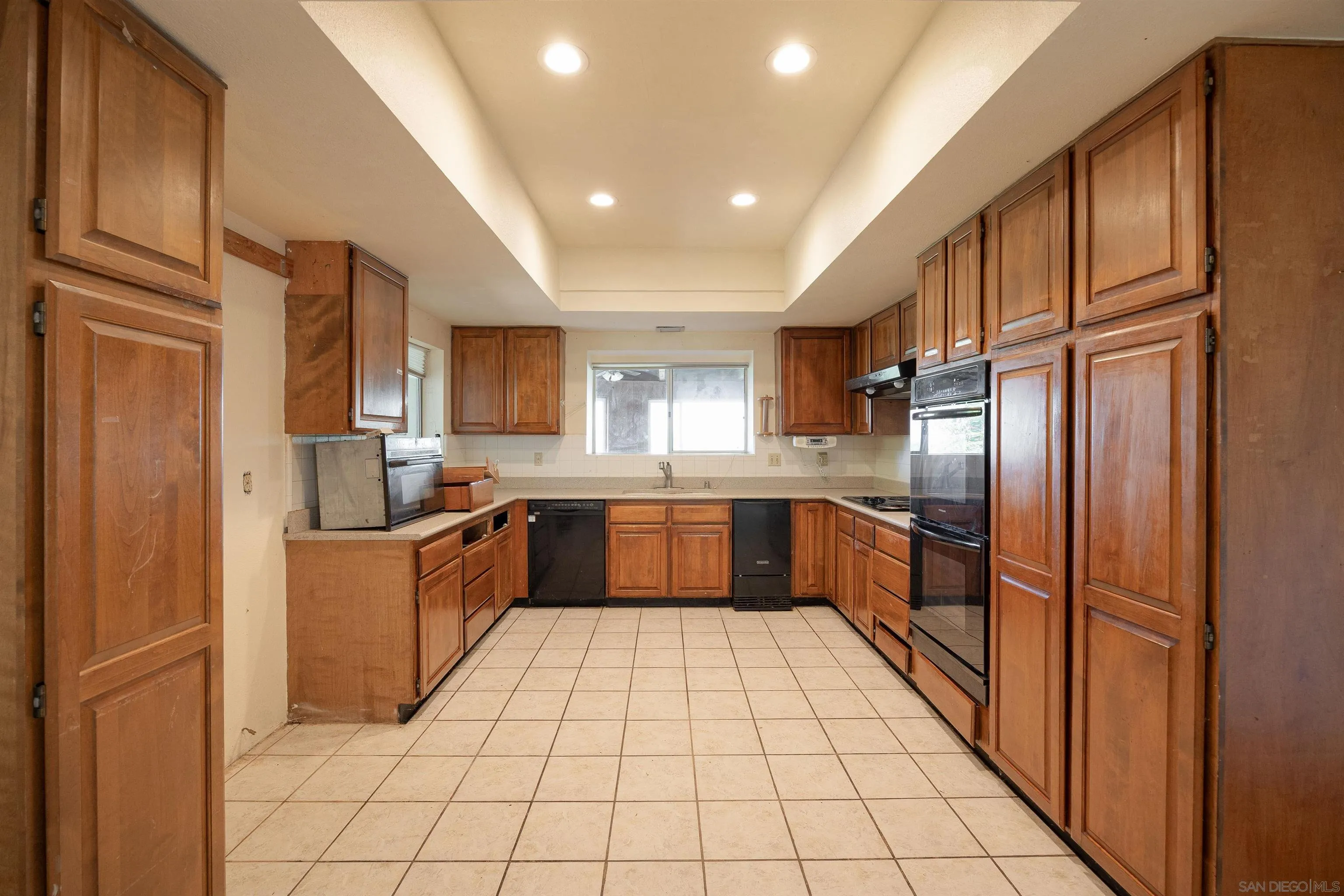 10171 Circle R Drive Valley Center, CA 92082 - Photo 6 of 19 a large kitchen with stainless steel appliances lots of counter top space