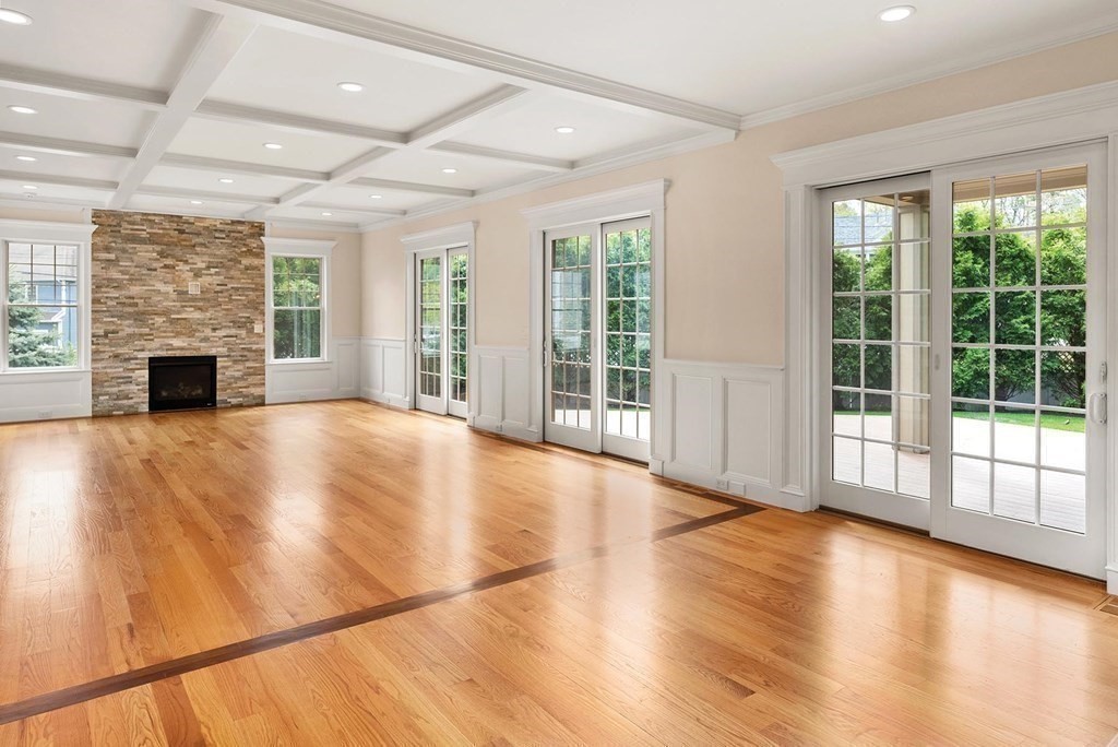 53 Van Roosen Road Newton, MA 02459 - Photo 8 of 34 a view of empty room with wooden floor and fireplace