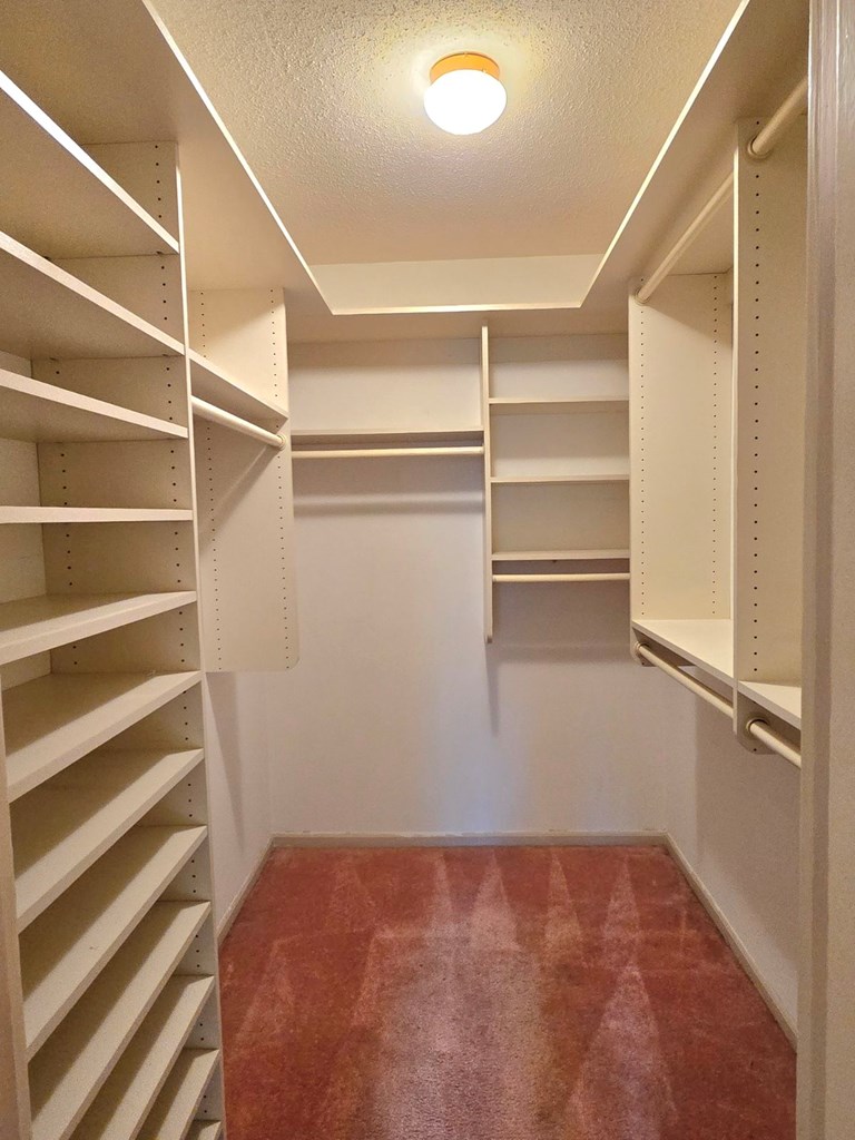 6851 Roswell Road Sandy Springs, GA 30328 - Photo 14 of 19 a view of walk in closet with empty racks