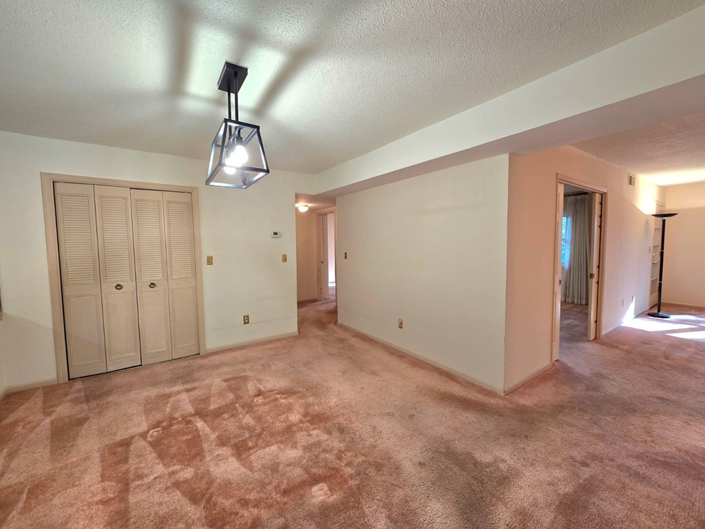 6851 Roswell Road Sandy Springs, GA 30328 - Photo 7 of 19 a view of an empty room and chandelier fan