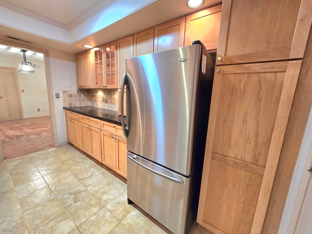 6851 Roswell Road Sandy Springs, GA 30328 - Photo 8 of 19 a kitchen with stainless steel appliances granite countertop a refrigerator and a sink