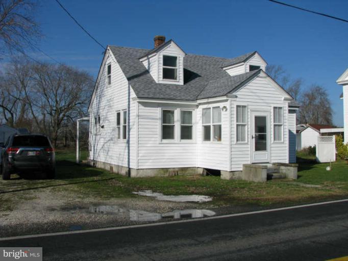 5030 Bethlehem Road Preston, MD 21655 - Photo 1 of 23 a front view of a house with a yard