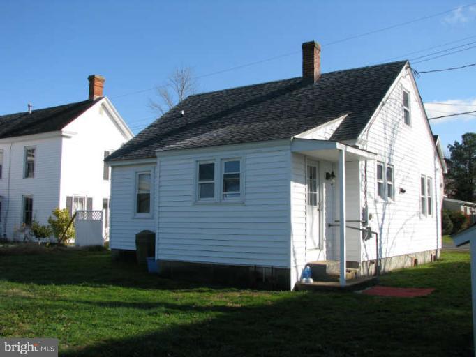 5030 Bethlehem Road Preston, MD 21655 - Photo 3 of 23 a front view of a house with a yard