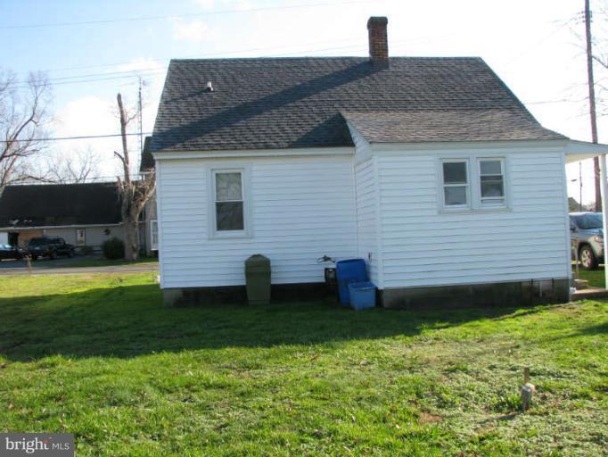 5030 Bethlehem Road Preston, MD 21655 - Photo 4 of 23 a front view of a house with garden