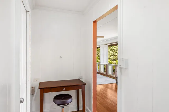 a view of an entryway with wooden floor
