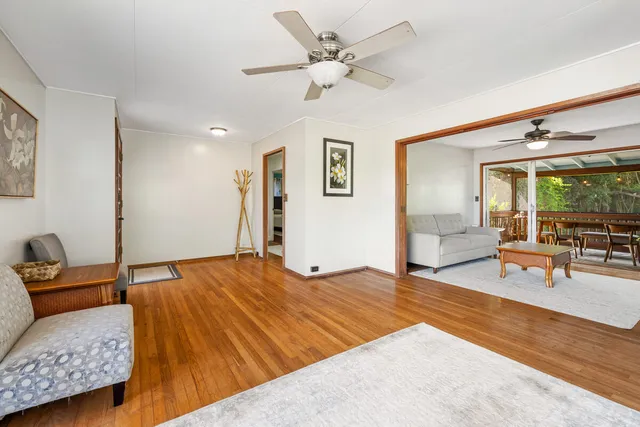 a bedroom with a bed and glass walk in closet