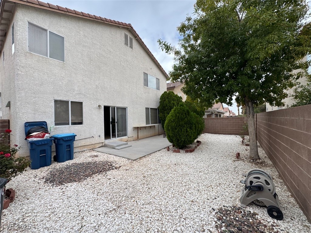 9915 Ridge Hill Avenue Las Vegas, NV 89147 - Photo 17 of 17 Rear view of house featuring a patio, a fenced backyard, stucco siding, and a tile roof