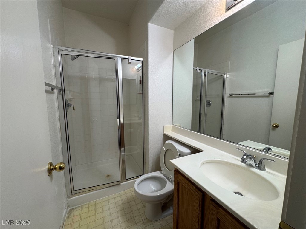 9915 Ridge Hill Avenue Las Vegas, NV 89147 - Photo 6 of 17 Bathroom featuring vanity and a stall shower