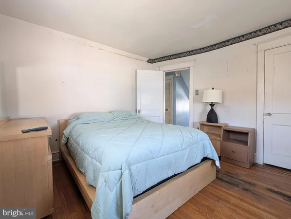 a bedroom with a bed and a closet