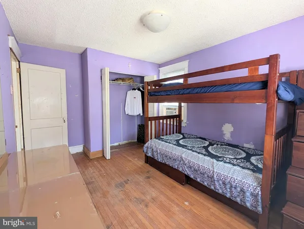 a bed room with a bed and a window