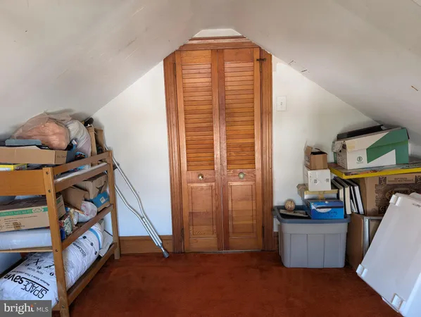 a view of room with window and hardwood floor