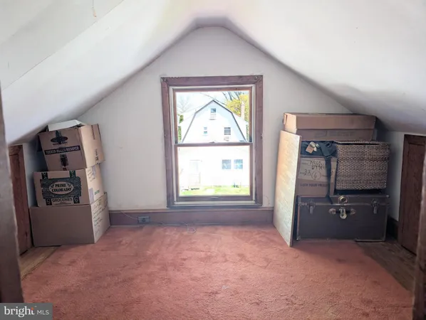 an empty room with windows closet and electronic appliances