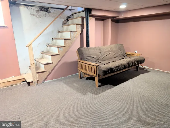 a view of livingroom with furniture and stairs