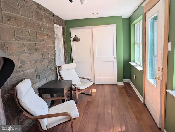 a workspace with furniture and wooden floor